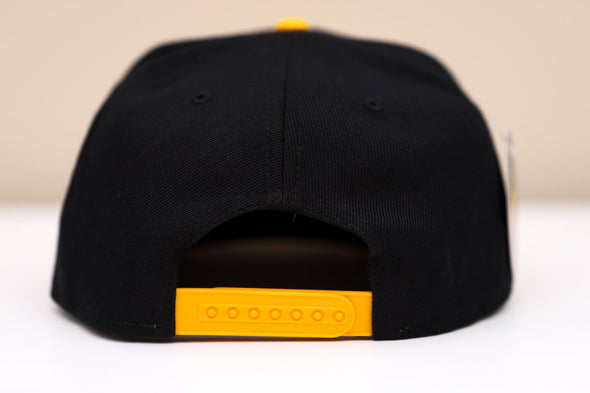 Broome Dusters™ Hat (Snapback) in black with yellow adjustable snap closure and structured high-profile design