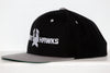 Black and gray snapback hat with New Haven Nighthawks logo embroidered on front panel