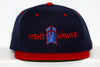 New Haven Nighthawks snapback hat with navy blue crown and red brim featuring team logo embroidery on front panel