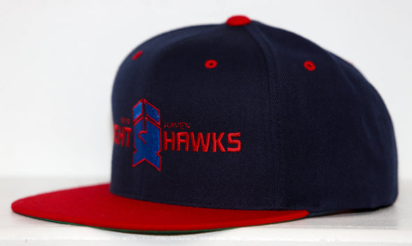 New Haven Nighthawks snapback hat in navy and red with embroidered team logo on front panel side view.