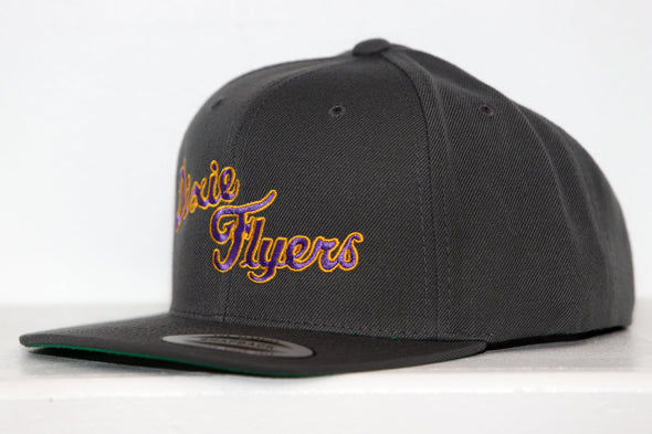 Black snapback hat with embroidered Nashville Dixie Flyers logo in yellow and purple cursive lettering