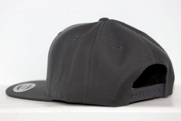 Black Nashville Dixie Flyers snapback hat shown from the back with adjustable strap and flat brim