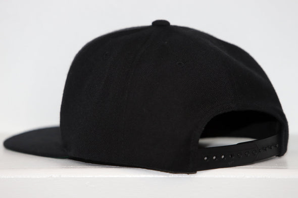 Columbus Chill Hat (Snapback) in black with adjustable strap and flat brim shown from back side