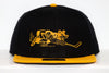 Cape Cod Cubs Hat (Snapback) in black and yellow with vintage hockey team mascot embroidered on front panel
