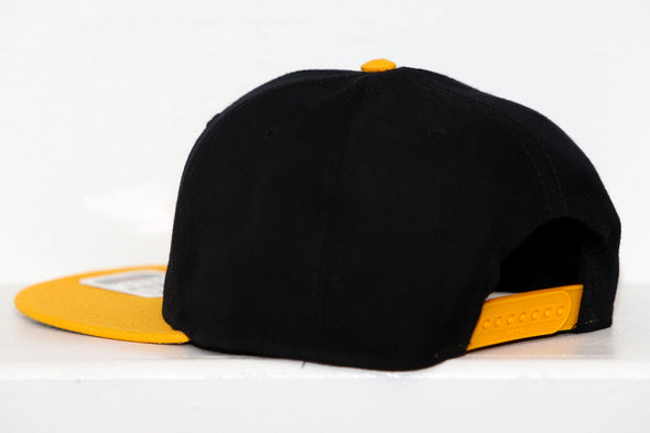Cape Cod Cubs Hat (Snapback) in black and yellow with vintage hockey team logo and adjustable snap closure back panel