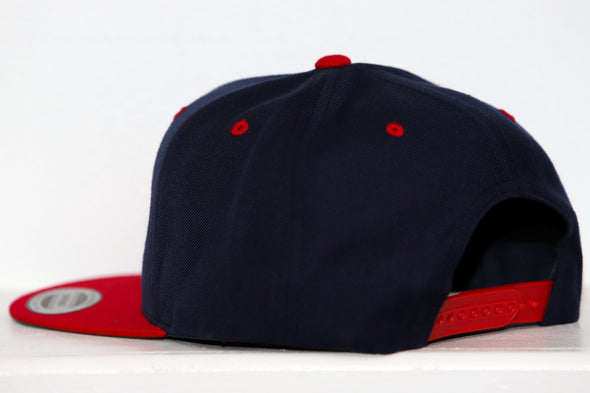 Black and red Amarillo Wranglers structured snapback hat with flat brim and adjustable closure shown from the side and back.