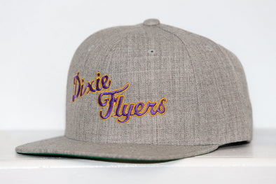 Gray snapback hat with embroidered Nashville Dixie Flyers logo in purple and gold thread