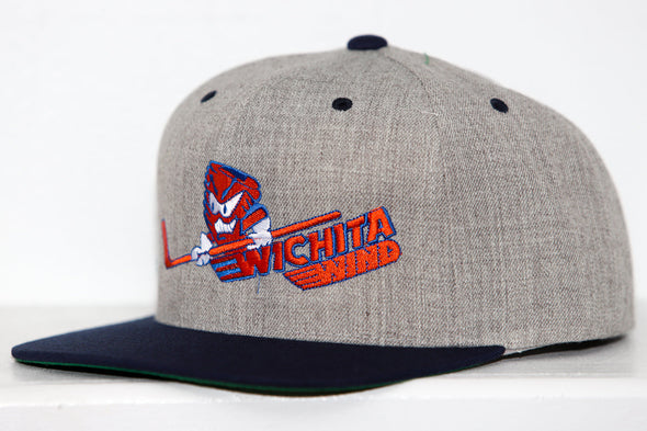 Gray snapback hat with black brim featuring Wichita Wind logo and text embroidered in red and blue