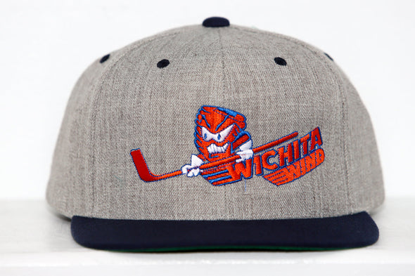 Gray snapback hat featuring the Wichita Wind logo with an angry tornado holding a hockey stick on the front panel
