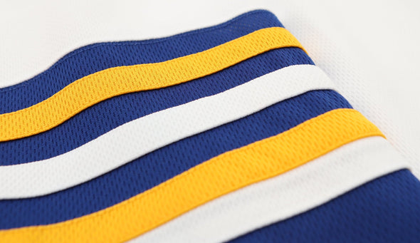 Flint Generals™ 1975-76 White Jersey (BLANK) close-up detail of vintage blue, yellow, and white striped fabric design