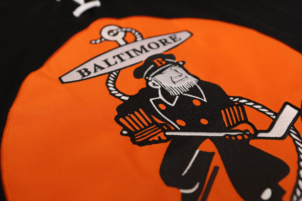 Baltimore Clippers® 1960s Black Jersey (BLANK) featuring vintage hockey logo with retro sailor and hockey stick design