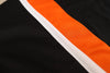 Baltimore Clippers® 1960s Black Jersey (BLANK) close-up of vintage hockey jersey fabric with orange and white stripes