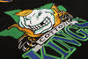 Lubbock Cotton Kings Jersey (BLANK) with retro vintage cotton king logo in green, blue, and gold colors on black fabric