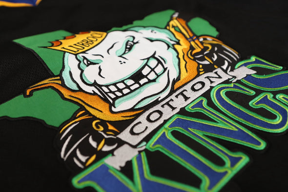 Lubbock Cotton Kings Jersey (BLANK) with retro vintage cotton king logo in green, blue, and gold colors on black fabric