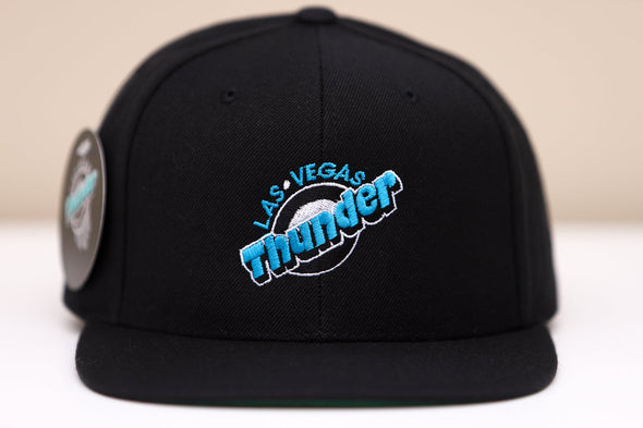 Black snapback hat featuring embroidered Las Vegas Thunder logo in blue and white on front panel